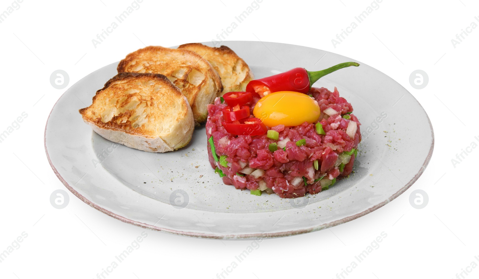 Photo of Tasty beef steak tartare served with yolk, toasted bread and other accompaniments isolated on white