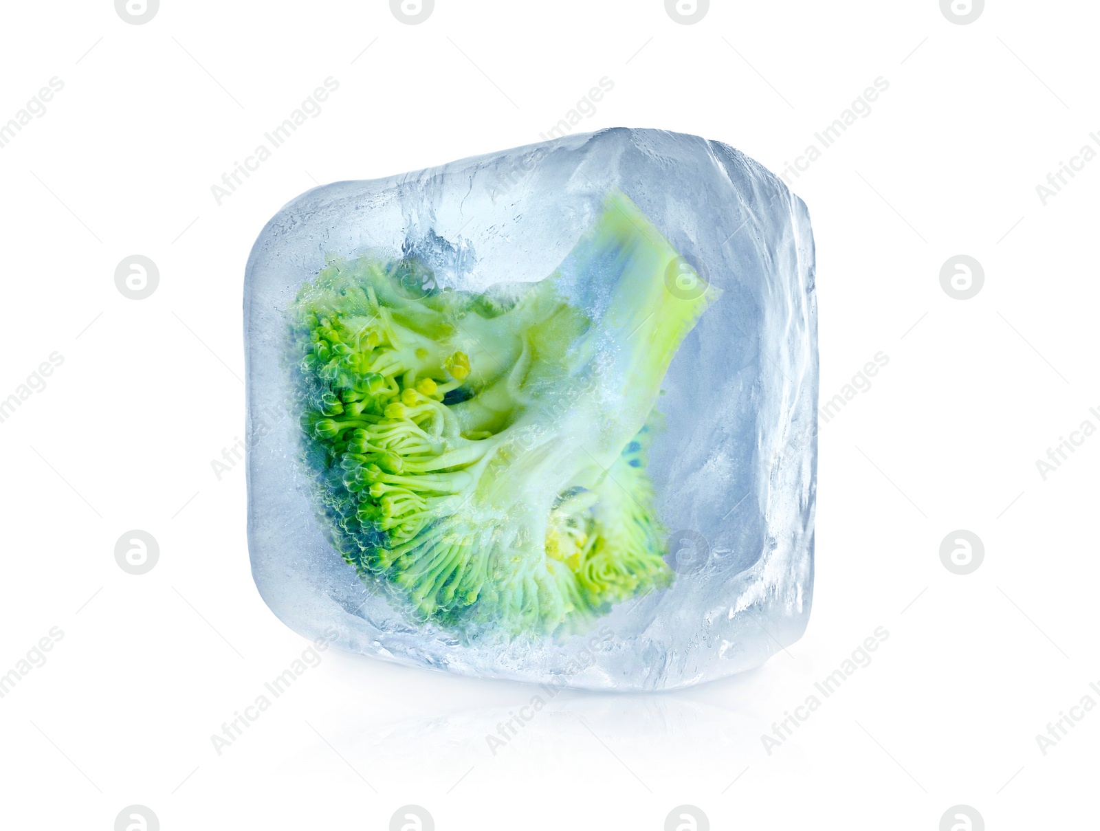 Image of Frozen food. Raw broccoli in ice cube isolated on white