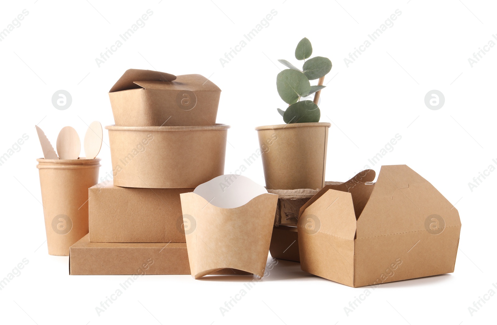 Photo of Eco friendly food packagings, wooden cutlery and eucalyptus leaves isolated on white