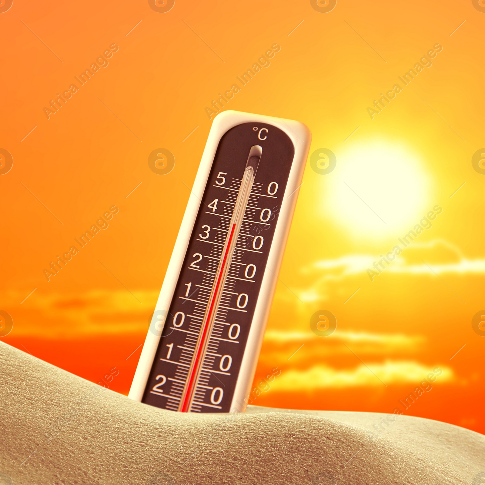 Image of Weather thermometer with high temperature outdoors on hot sunny day. Heat stroke warning