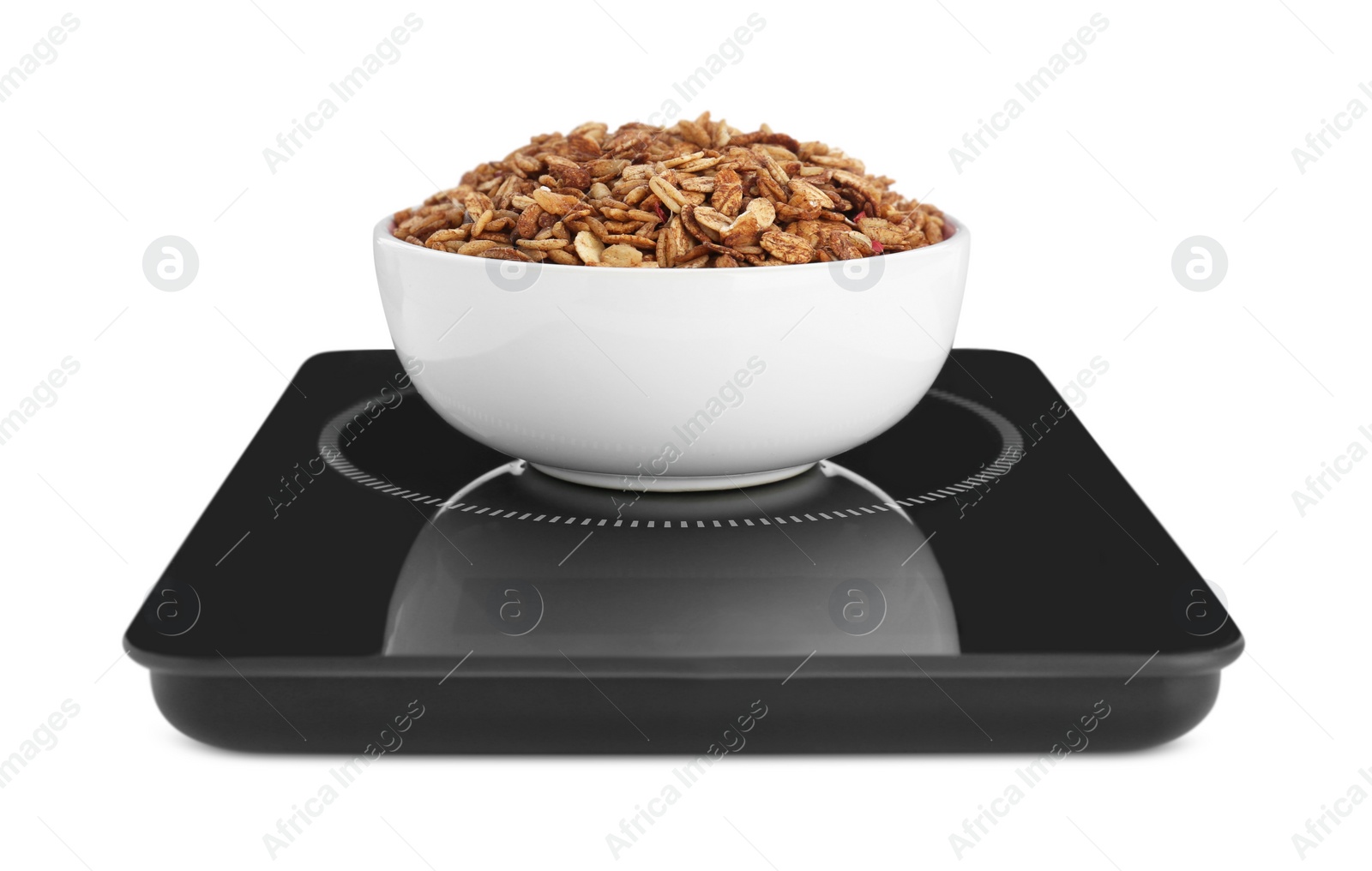 Photo of Modern kitchen scale with bowl of tasty granola isolated on white