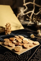 Photo of Composition with wooden runes on divination mat