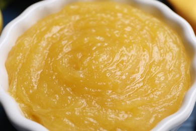 Photo of Delicious lemon curd in bowl, closeup view