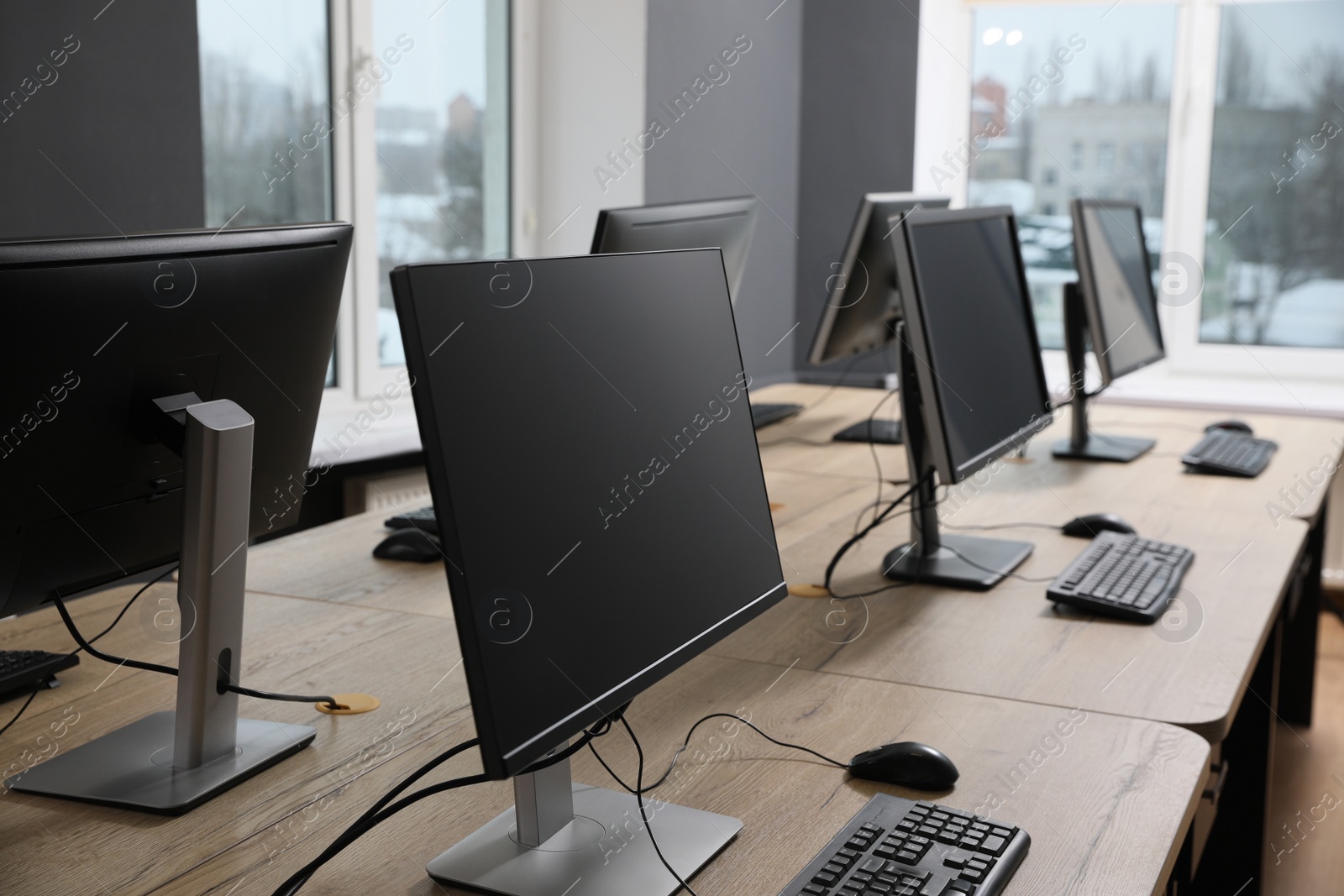 Photo of Many modern computers in open space office