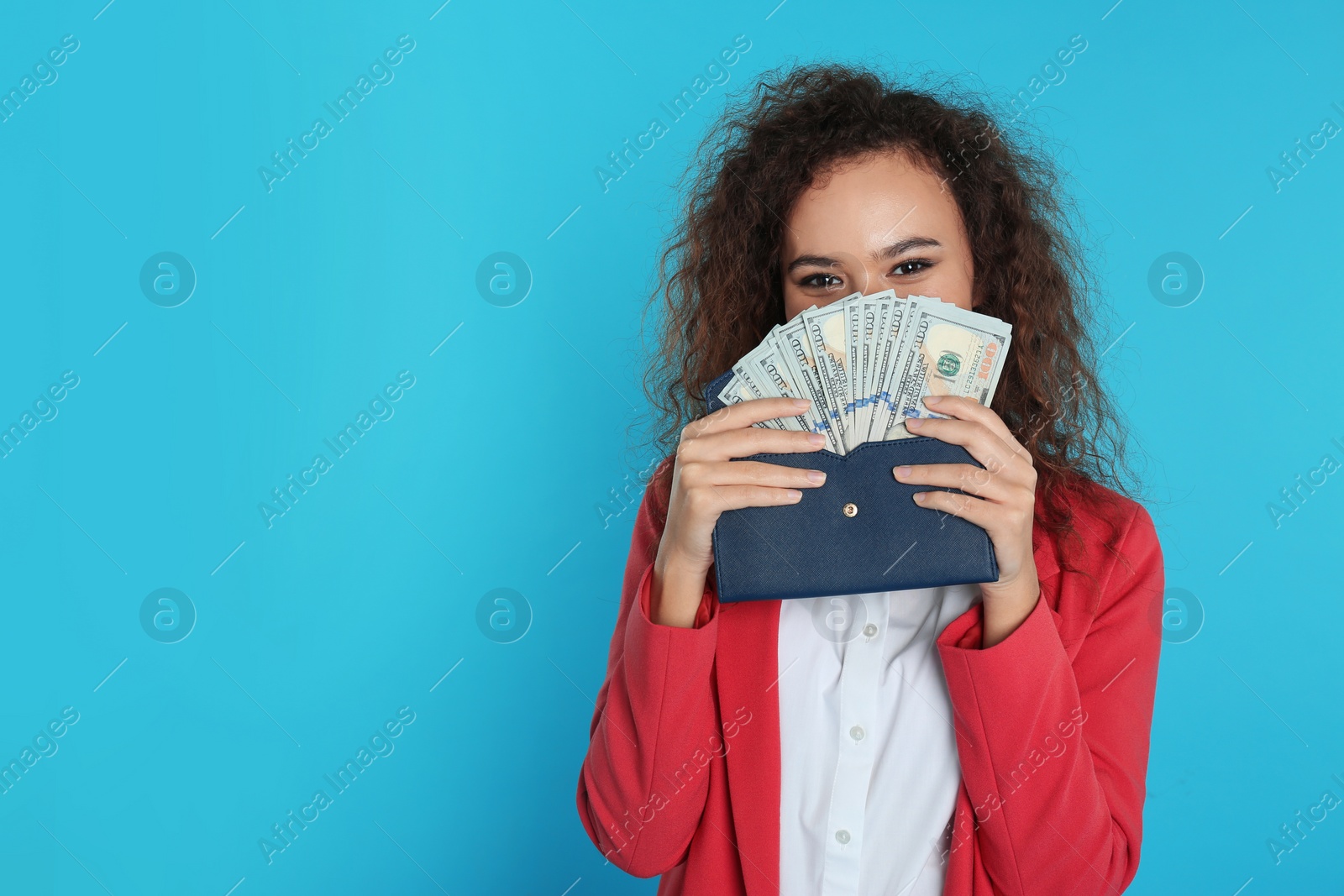 Photo of African-American businesswoman with money in wallet on color background. Space for text