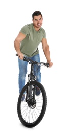 Photo of Handsome young man with modern bicycle on white background