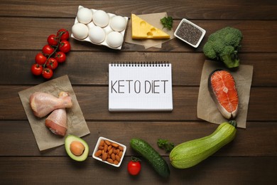 Flat lay composition with keto diet products on wooden table