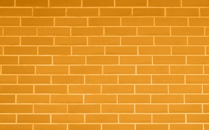 Texture of orange color brick wall as background