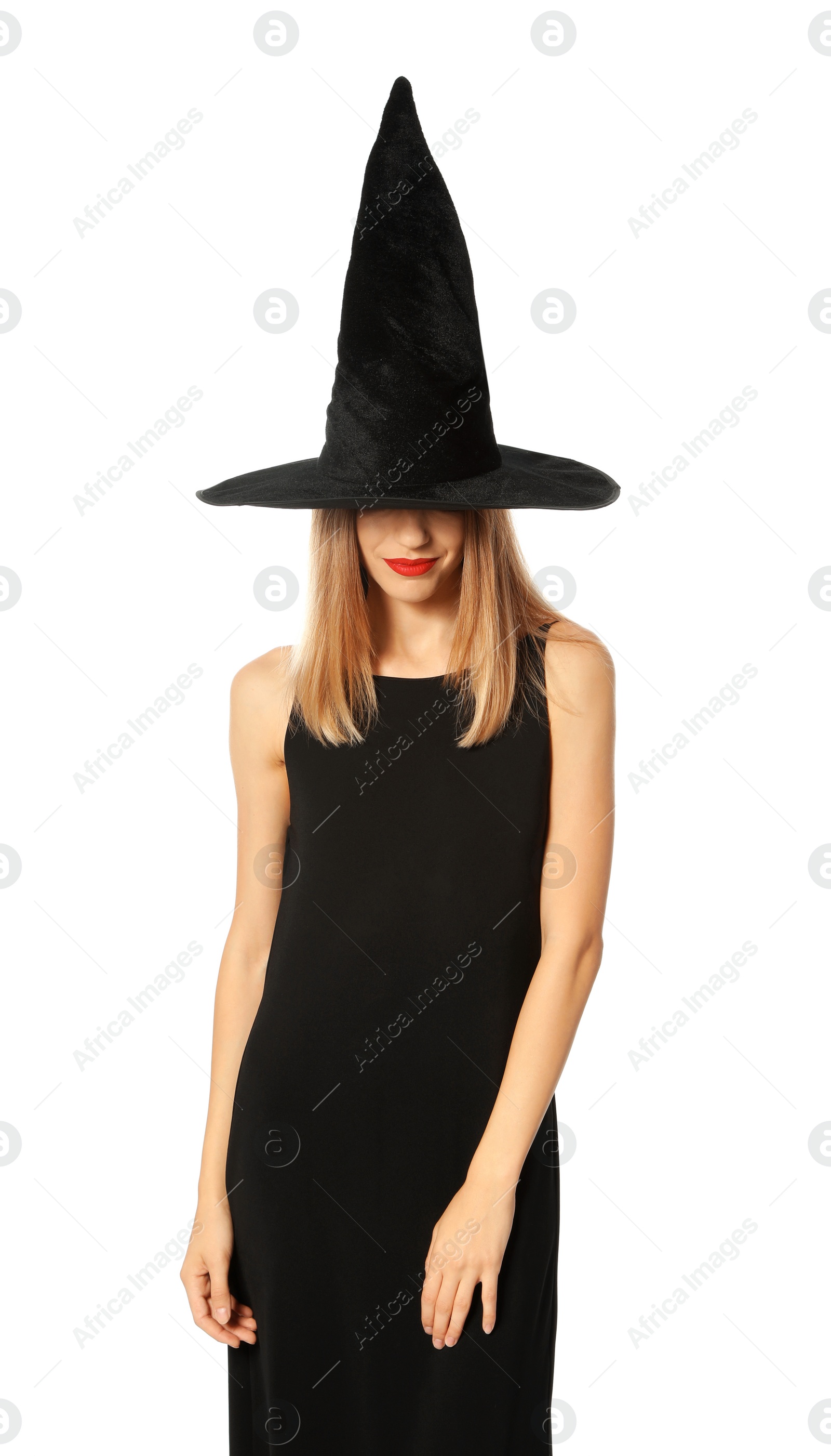 Photo of Beautiful young woman wearing witch costume for Halloween party on white background