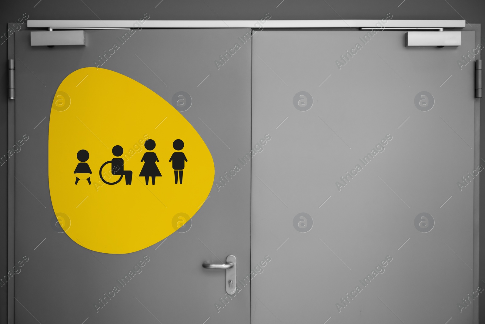 Image of Public toilet sign with symbols on door
