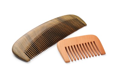 Photo of New wooden hair combs isolated on white