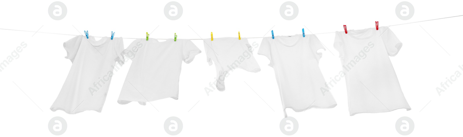 Photo of Many t-shirts drying on washing line isolated on white, low angle view