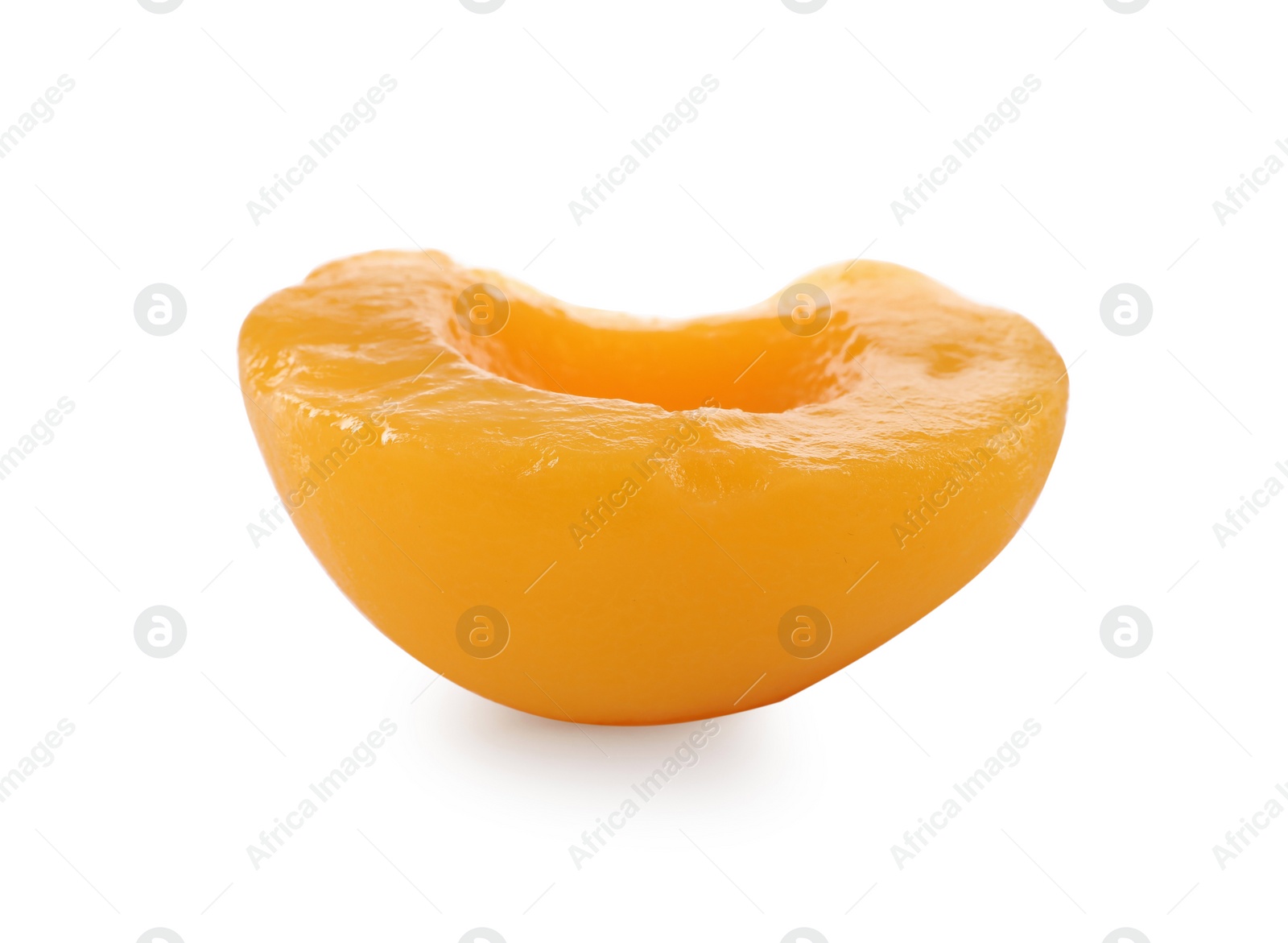 Photo of Sweet juicy canned peach half isolated on white