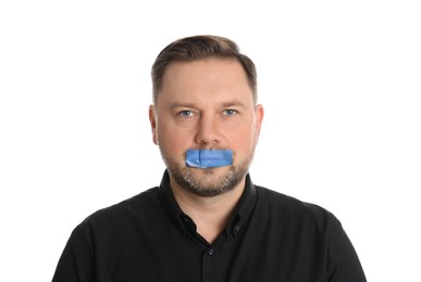 Mature man with taped mouth on white background. Speech censorship