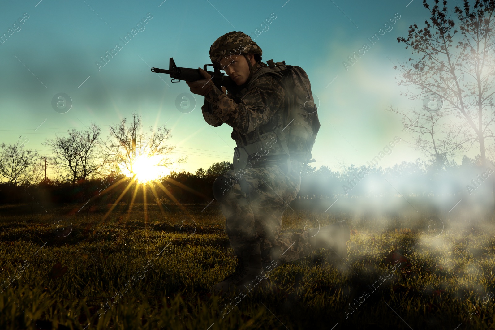 Image of Soldier with machine gun on battlefield. War conflict