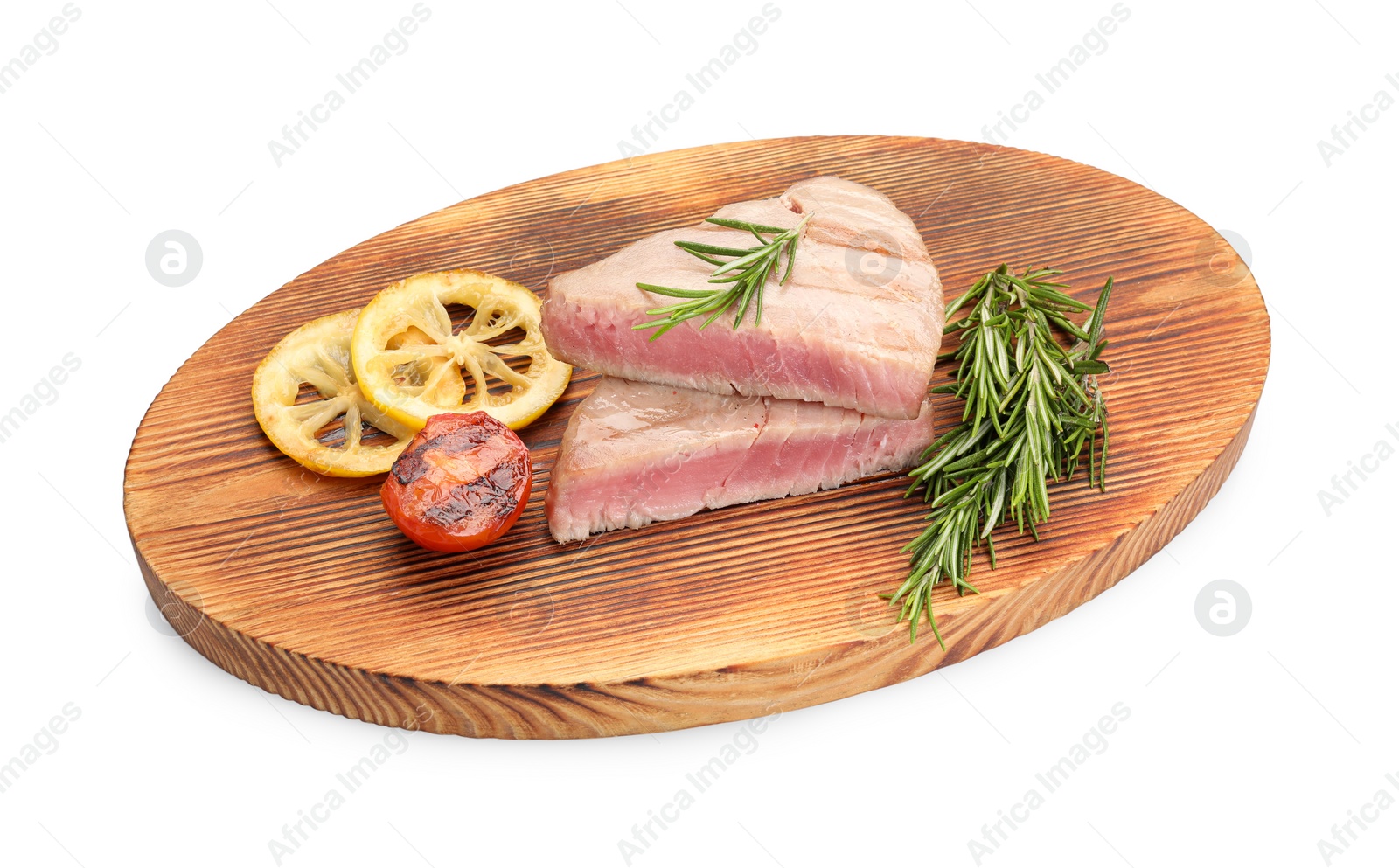 Photo of Pieces of delicious tuna steak with rosemary, tomato and lemon on white background