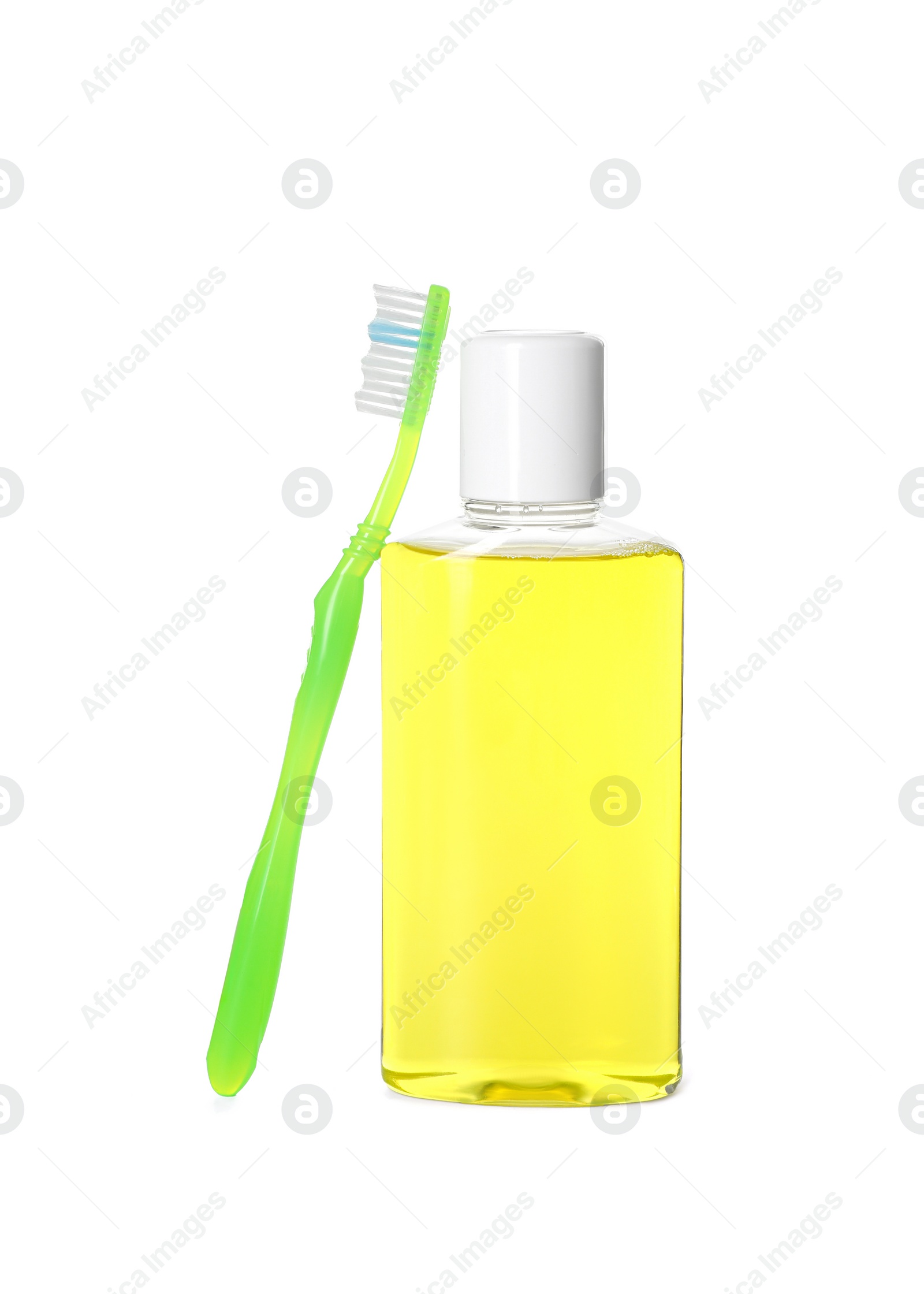 Photo of Bottle of mouthwash and toothbrush isolated on white