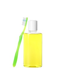 Bottle of mouthwash and toothbrush isolated on white
