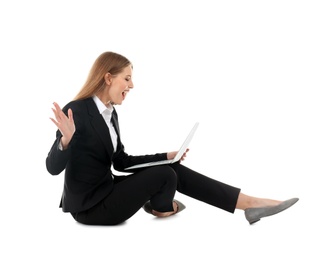 Photo of Emotional businesswoman in office wear with laptop celebrating victory on white background