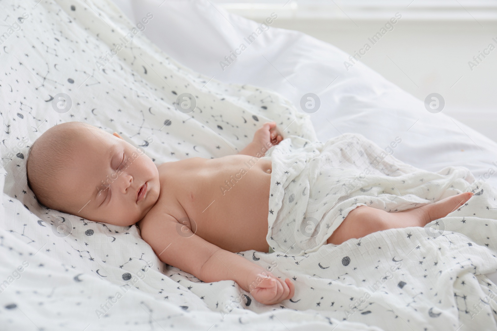 Photo of Cute little baby sleeping on bed at home