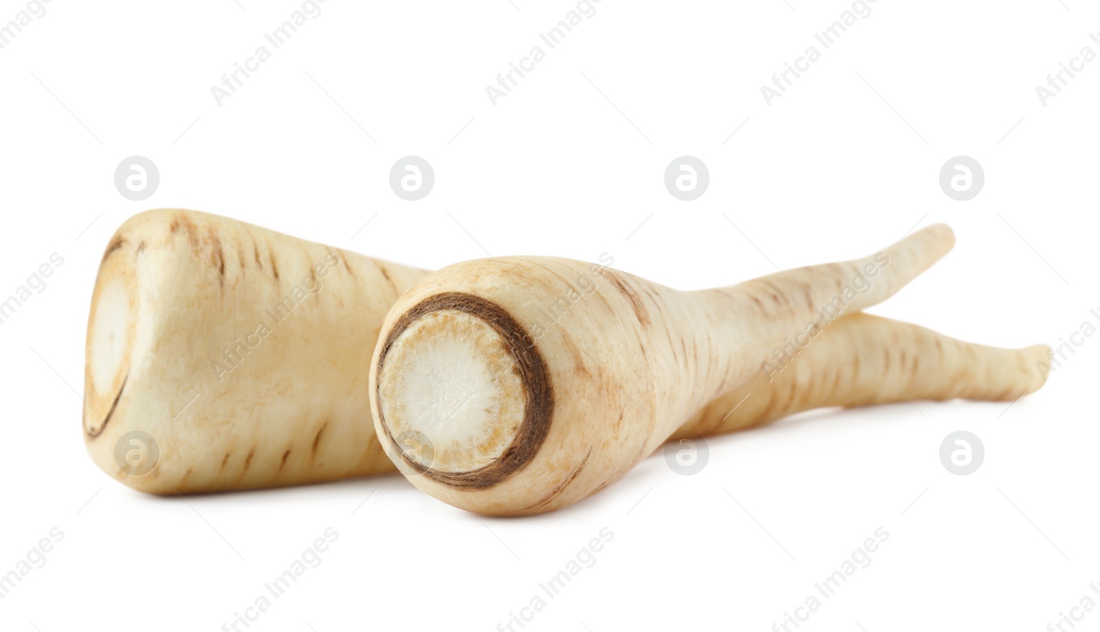 Photo of Tasty fresh ripe parsnips on white background