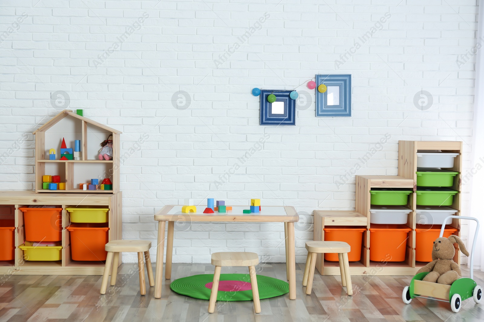 Photo of Modern child room interior with table and stools