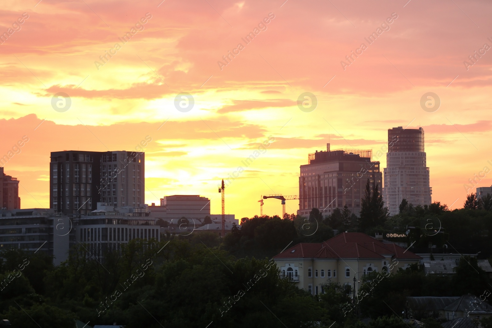 Photo of KYIV, UKRAINE - MAY 23, 2019: City district with modern buildings at sunset