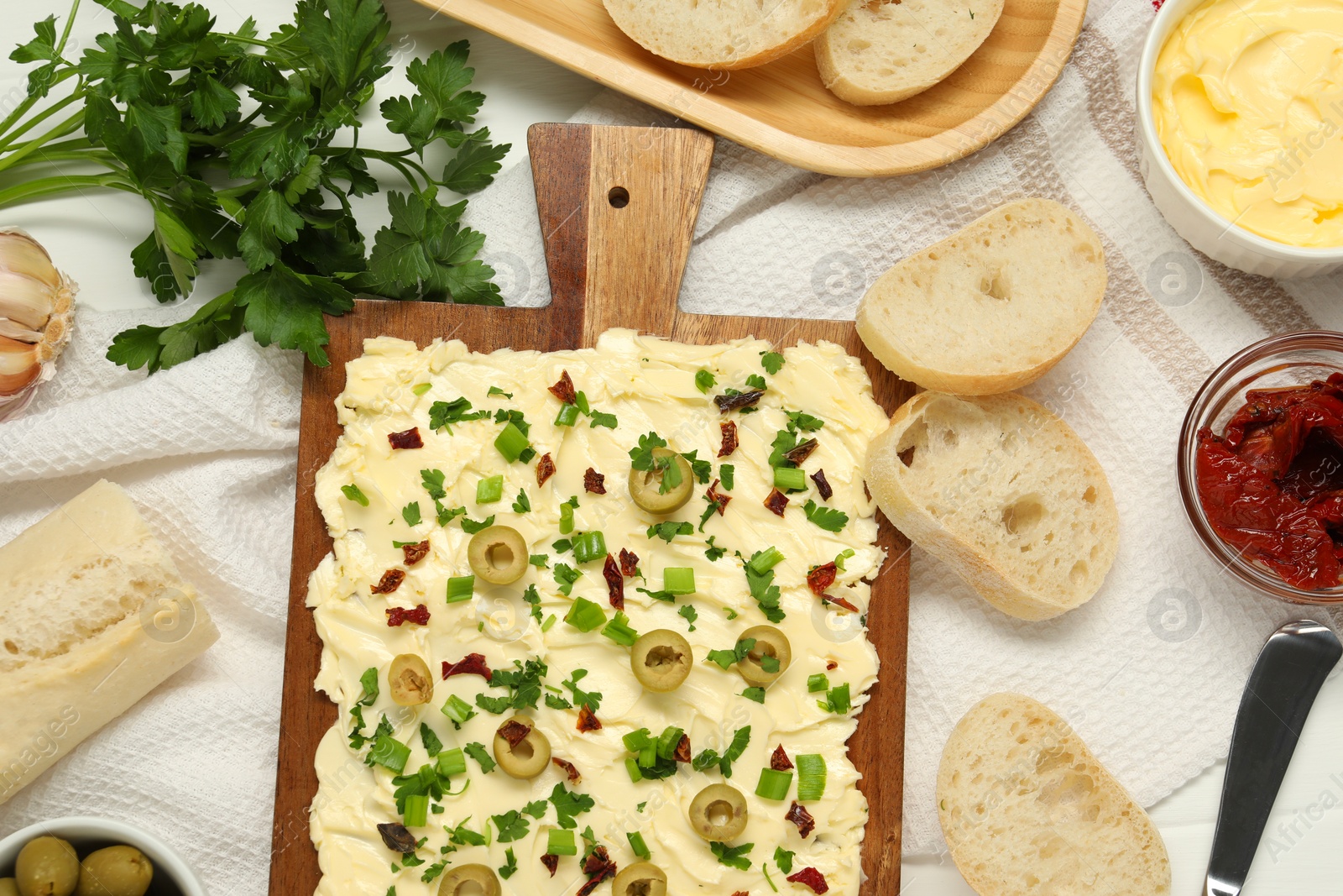 Photo of Flat lay composition with fresh butter board and bread on table