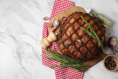 Photo of Delicious baked ham served on white marble table, flat lay. Space for text