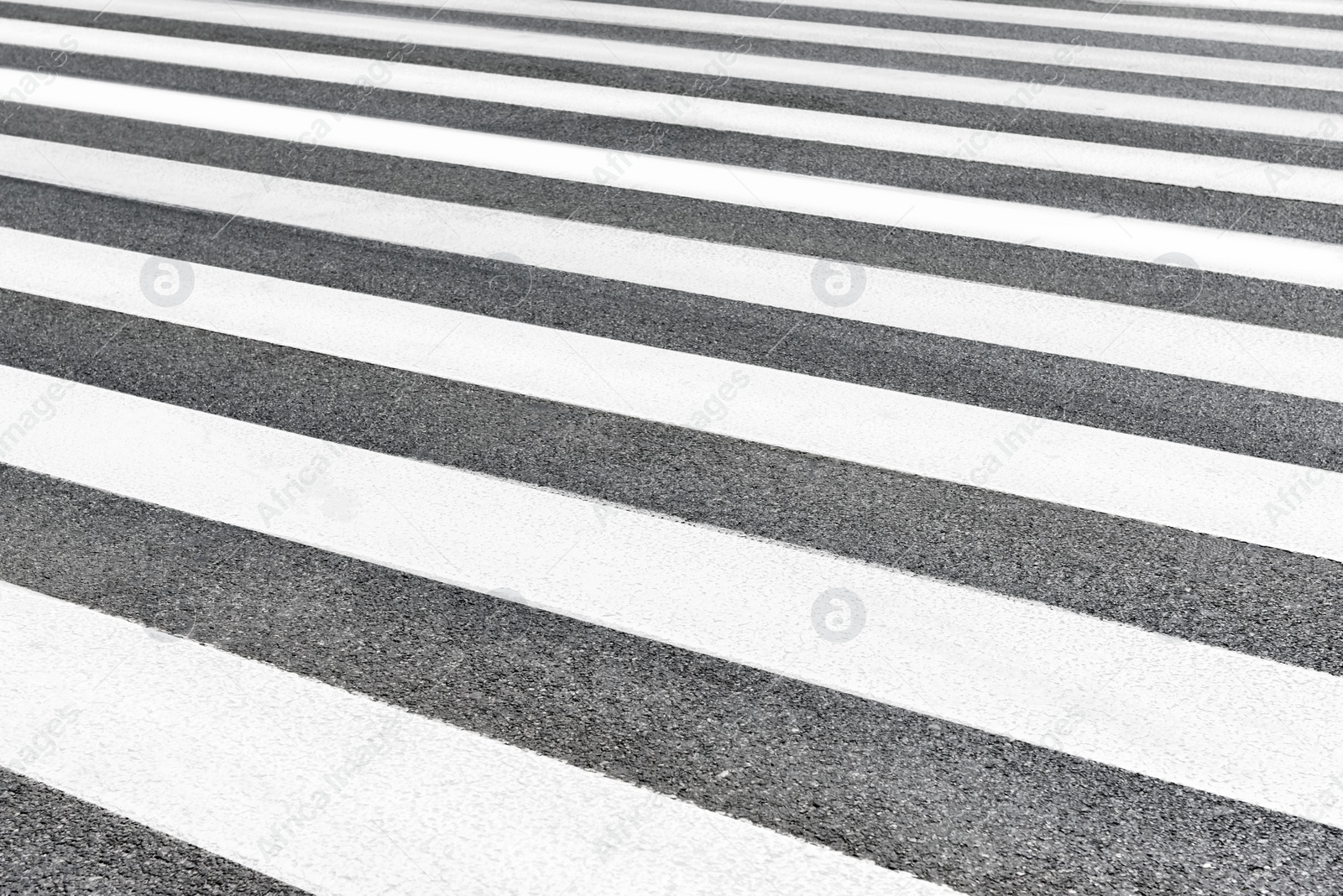Photo of Pedestrian crossing on asphalt as background. Road regulations
