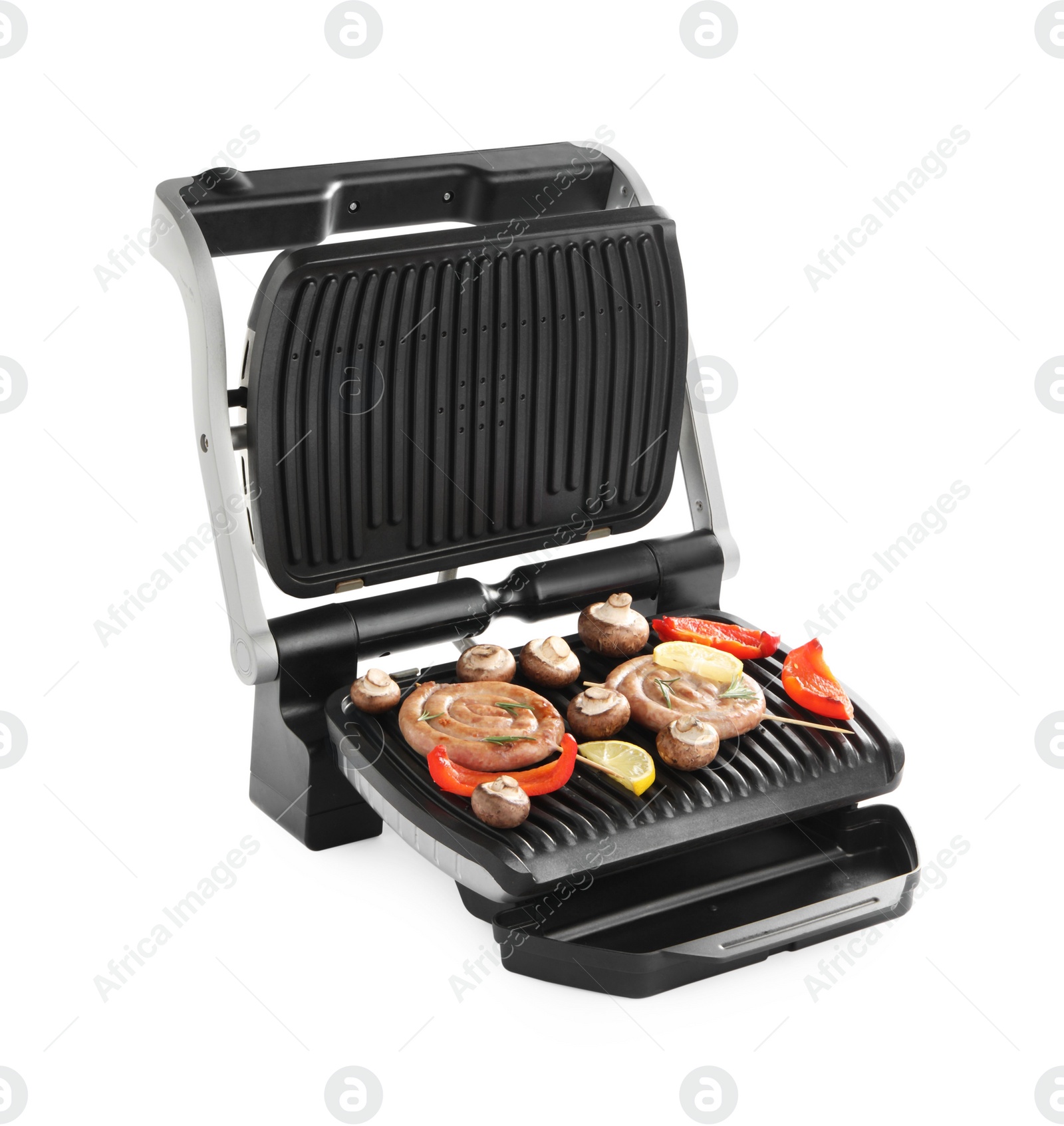 Photo of Electric grill with homemade sausages, mushrooms and bell pepper isolated on white