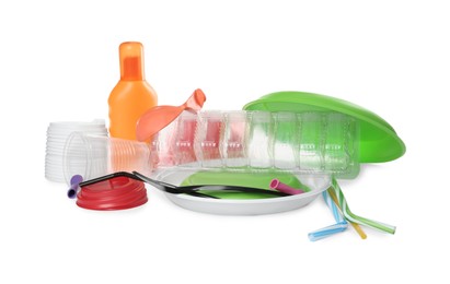 Photo of Pile of different plastic items on white background