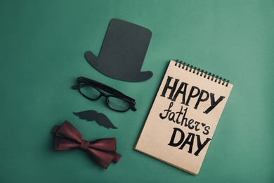 Flat lay composition with bow tie and paper decor on color background. Happy Father's Day