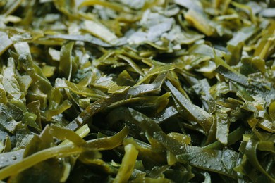 Photo of Fresh laminaria (kelp) seaweed as background, closeup