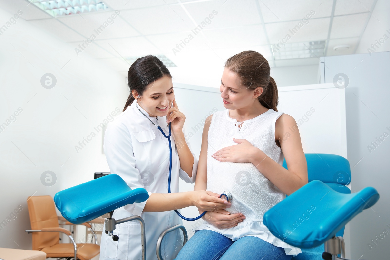 Photo of Pregnant woman having appointment at gynecologist office