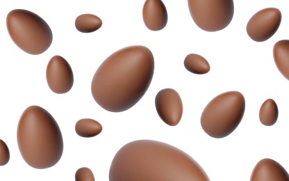 Image of Many chocolate eggs falling on white background
