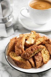 Photo of Traditional Italian almond biscuits (Cantucci) on white marble table, closeup