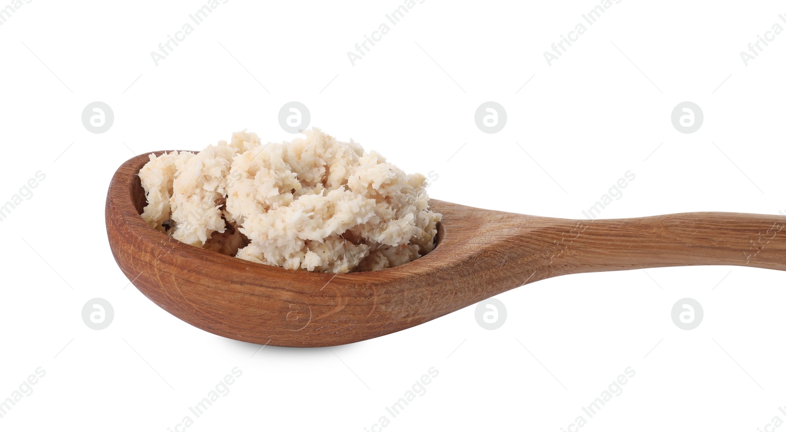 Photo of Wooden spoon with tasty prepared horseradish isolated on white