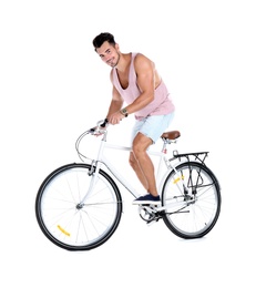 Photo of Handsome young hipster man riding bicycle on white background