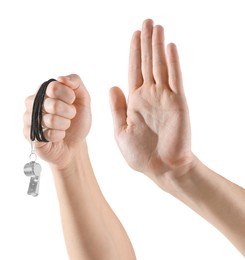 Photo of Referee holding whistle and showing stop gesture on white background, closeup