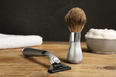 Set of men's shaving tools on wooden table