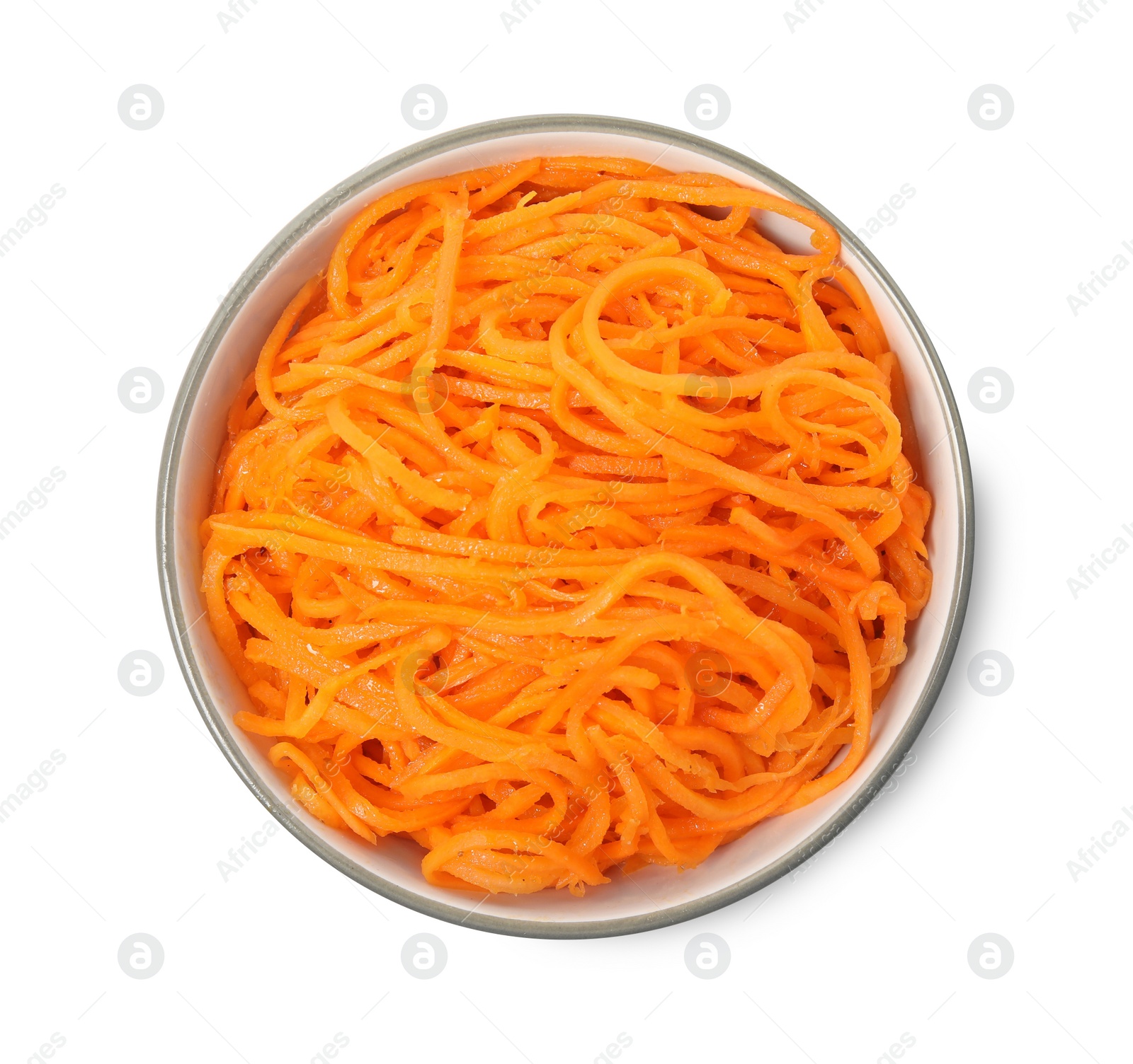 Photo of Delicious Korean carrot salad in bowl isolated on white, top view