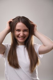 Photo of Portrait of beautiful woman on gray background