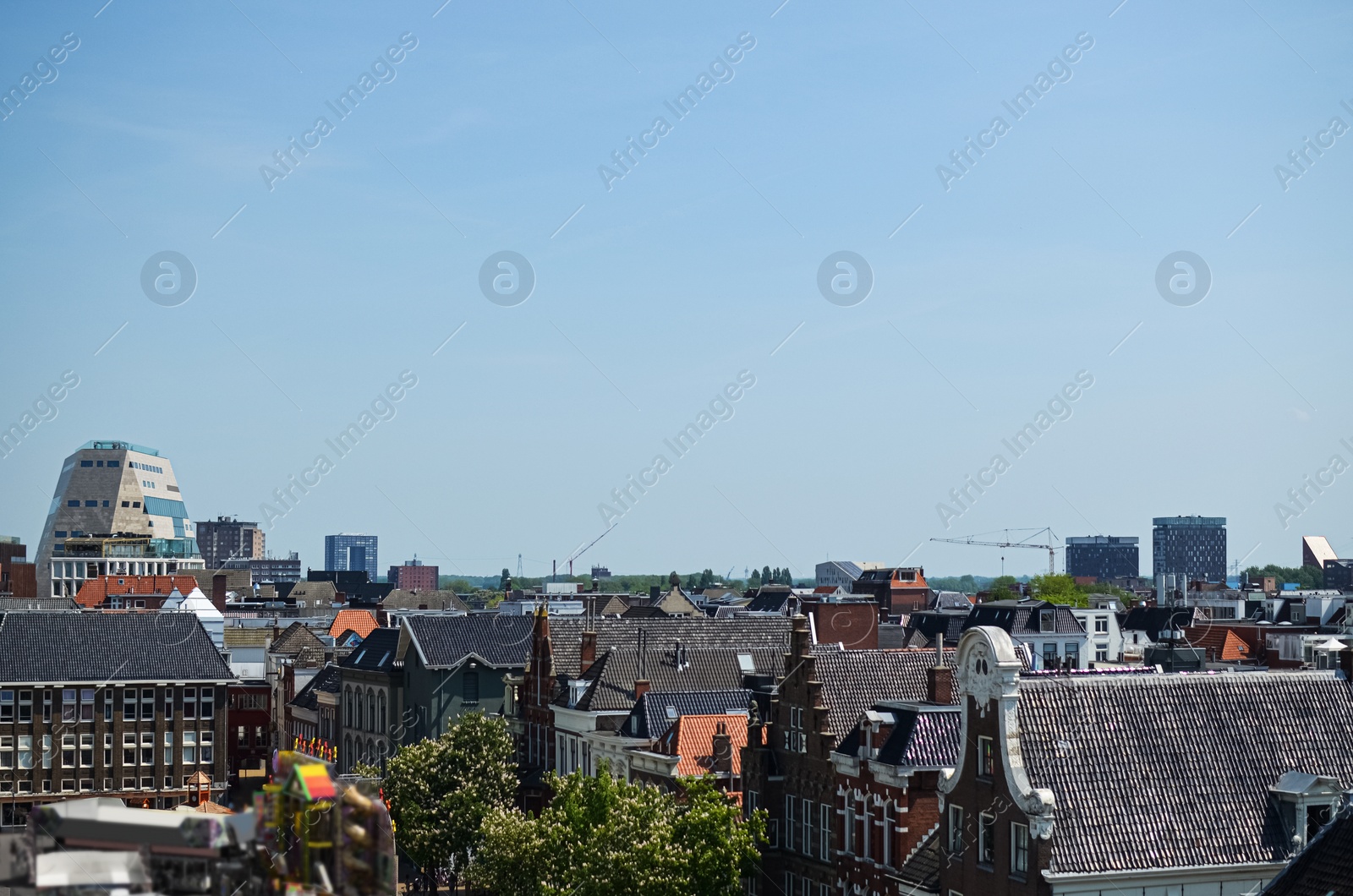 Photo of Picturesque view of city with beautiful buildings under blue sky