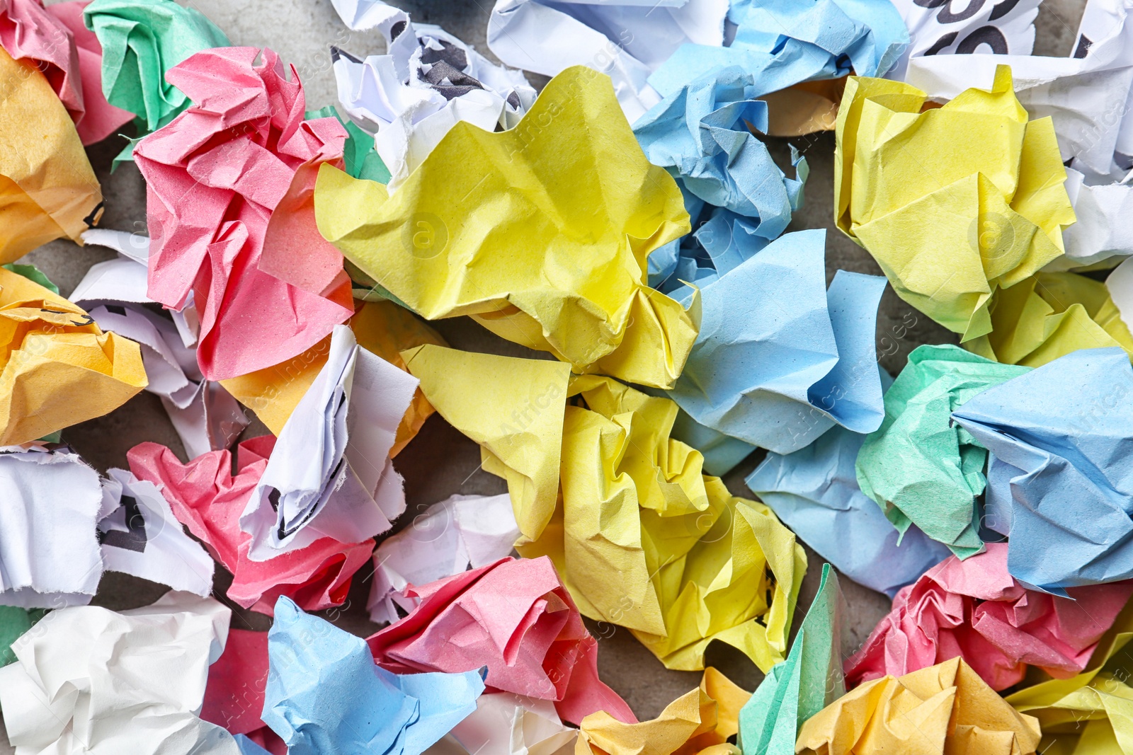 Photo of Pile of crumpled paper on grey background, top view. Recycling problem