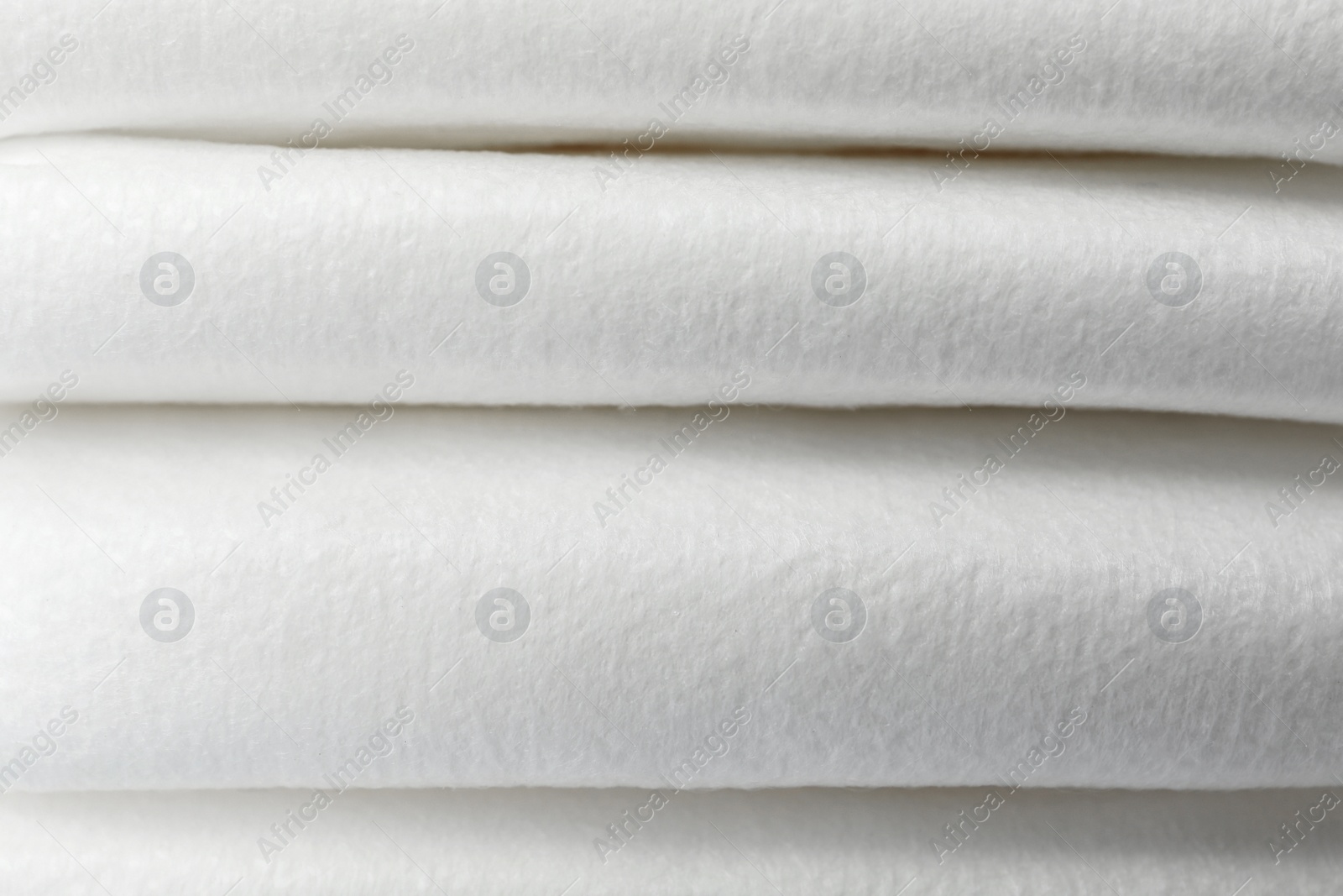 Photo of Stack of baby diapers as background, closeup
