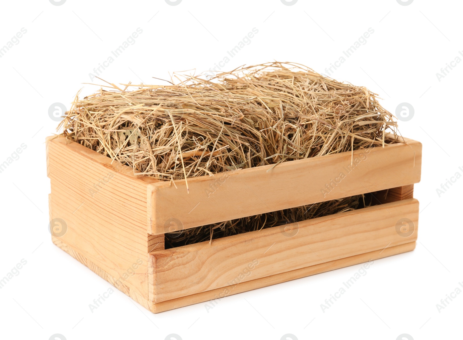 Photo of Dried hay in wooden crate on white background