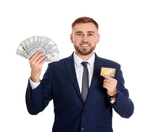 Photo of Portrait of young businessman holding money banknotes and credit card on white background