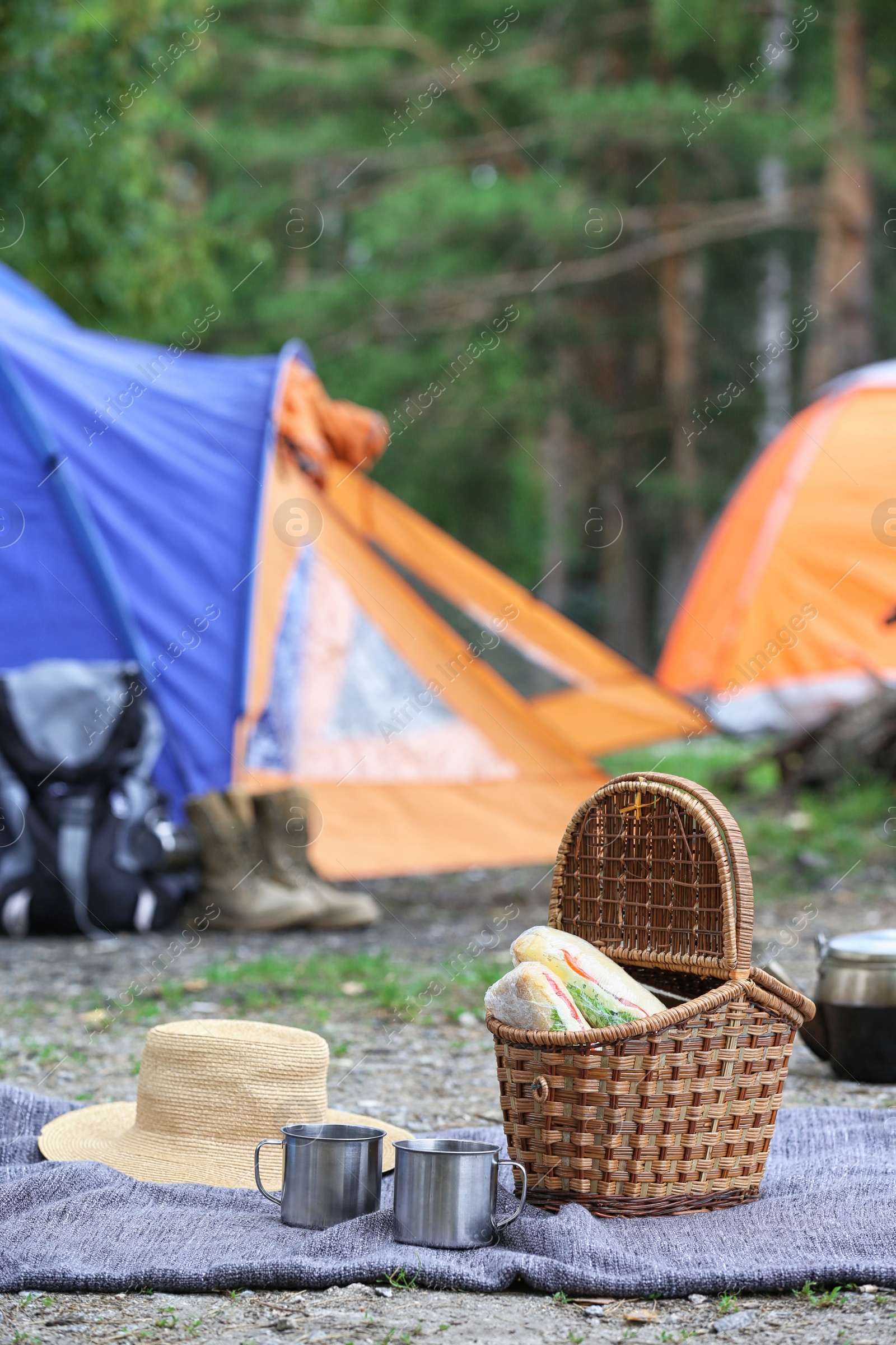 Photo of Set of camping equipment outdoors on summer day