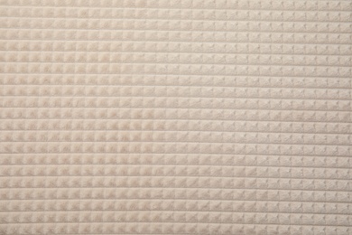 Photo of Soft warm white plaid as background, closeup